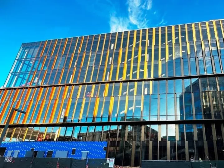 Construction image of the glass and steel facade of the 1450 Owens laboratory / science building in Mission Bay, CA.