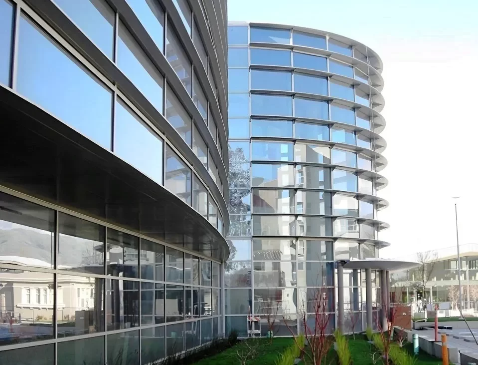 The curved steel horizontal shading devices on the entrance to the Valley Health Center in Milpitas.