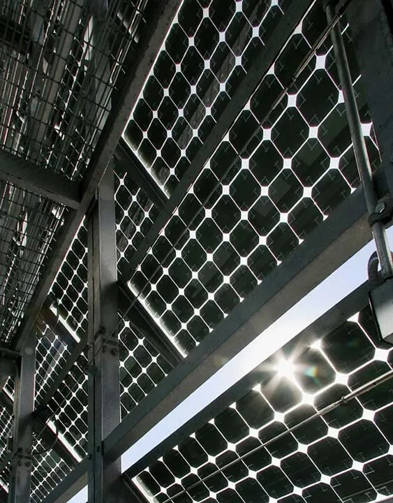 A close-up of the Building-Integrated Photovoltaic panels on Caltrans District 7 HQ building facade with the sun shining through the panels.