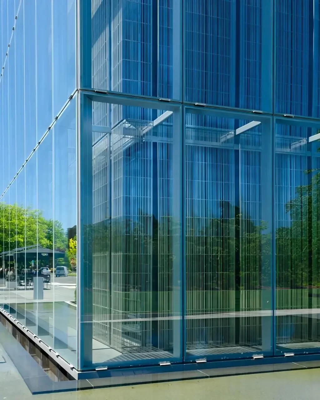 A close up of a corner of the blue facade of the Jaqua Center for Student Athletes at the University of Oregon, showing the cavity of the double-skin facade.
