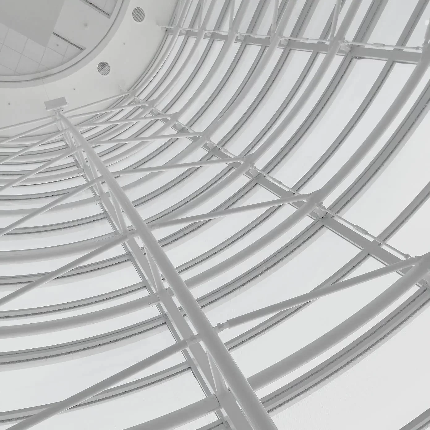 Interior view of the white, space-frame facade support of the Moscone Convention Center West in San Francisco.