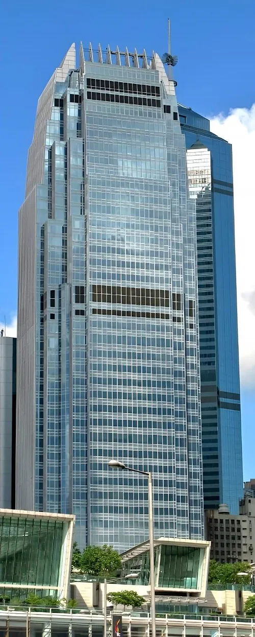The green-blue high-rise facade of the One International Finance Centre in Hong Kong.