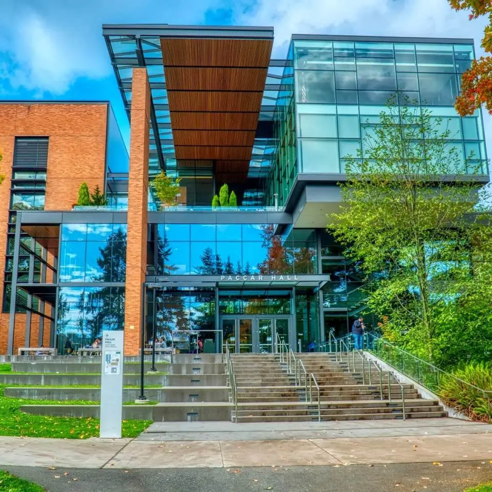 The glass, steel, and brick facade of PACCAR Hall at University of Washington.