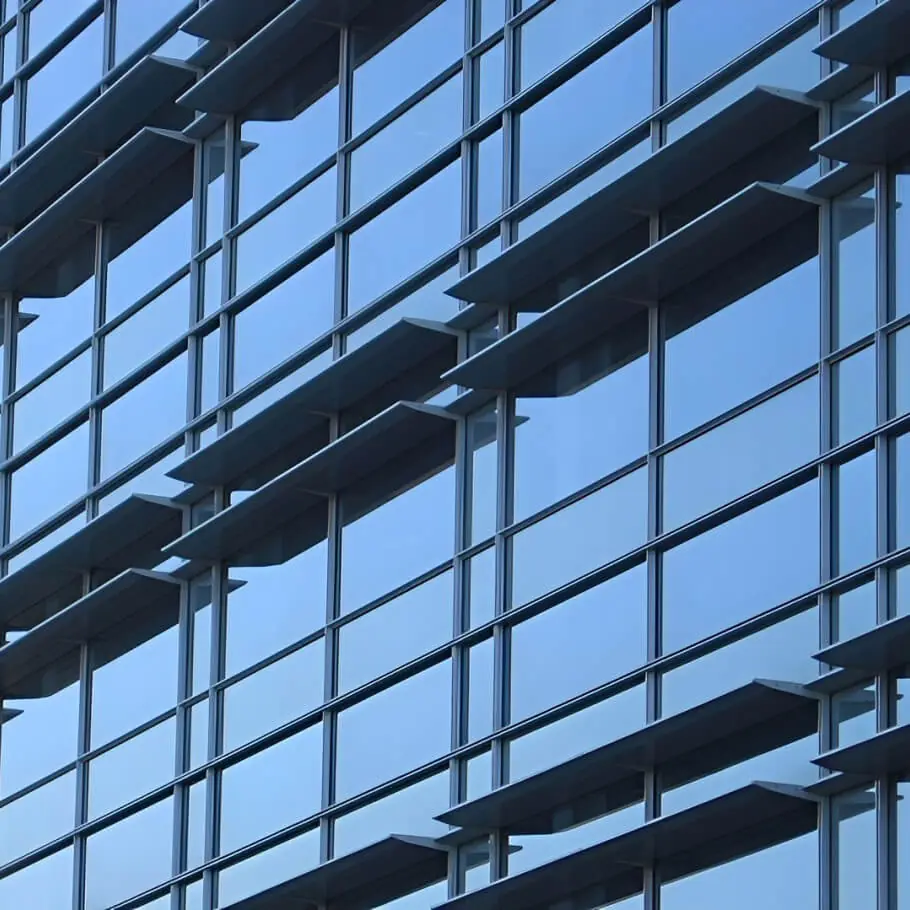 The horizontal shading system projecting from the blue and gray facade of Valley Specialty at Santa Clara Valley Medical Center.