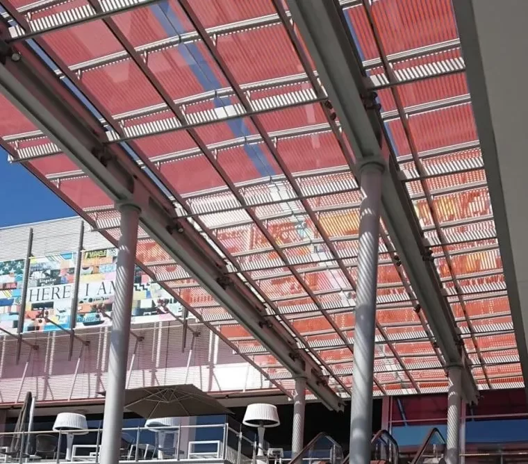 Red fabric canopies shading the glass storefront of City Center Bishop Ranch in San Ramon, CA.