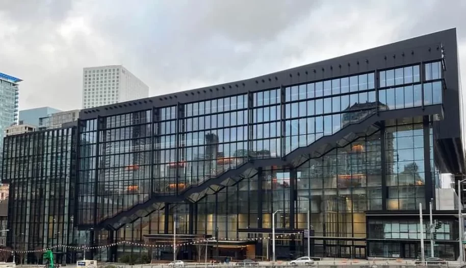 The charcoal and blue glass facade of the Seattle Convention Center.