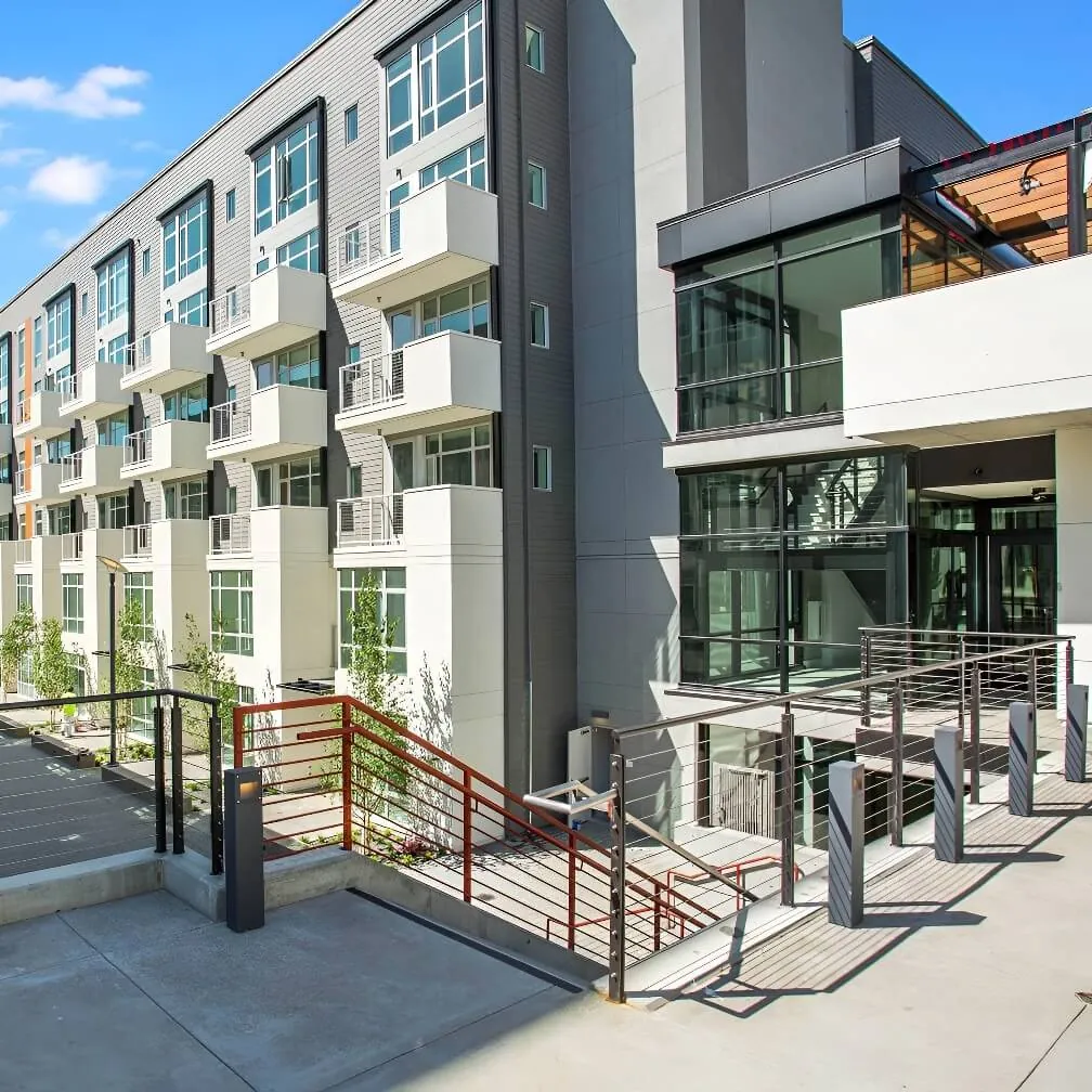 An interior courtyard corner of the Alta Laguna Multifamily Housing development in San Francisco showing details pf the balconies and other facade transitions.